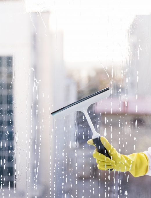 man cleaning window